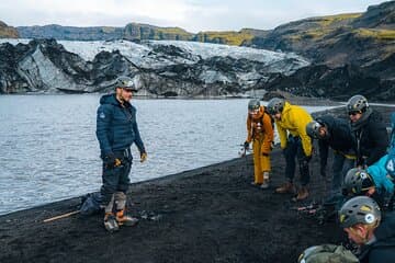 Gearing up with crampons, helmets, and harnesses before stepping on the glacier