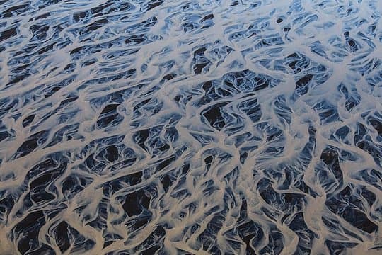 Airplane tour over black sands and riverbeds from Skaftafell