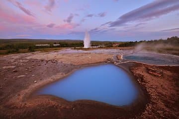 Hot Springs and Geyser Strokkur in Midnight Sun light