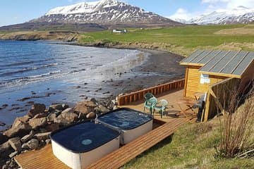 You will also find in Hauganes geothermally heated hot tubs