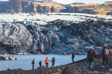 Kayakers paddle up close and hikers explore the glacier, a natural phenomenon.