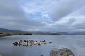 Experience traditional Icelandic bathing culture as you take a bath in the serene hot springs