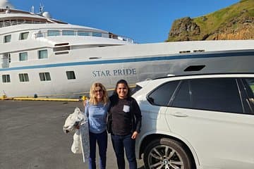 Wind Star pride in the background, popular cruise ship
