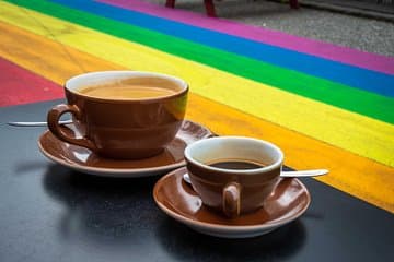 Enjoy a cup coffee and listen to the origin of the Rainbow Street art piece, celebrating the inclusiveness of Icelandic society