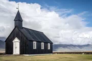 Stop at the striking black church of Búðir, set in a lava field with a glacier backdrop