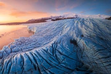 An aerial view shows the rugged, icy surface of a glacier in Skaftafell.