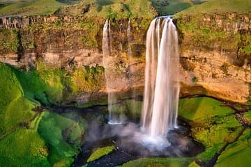 Step behind cascading waters for a truly magical Icelandic experience